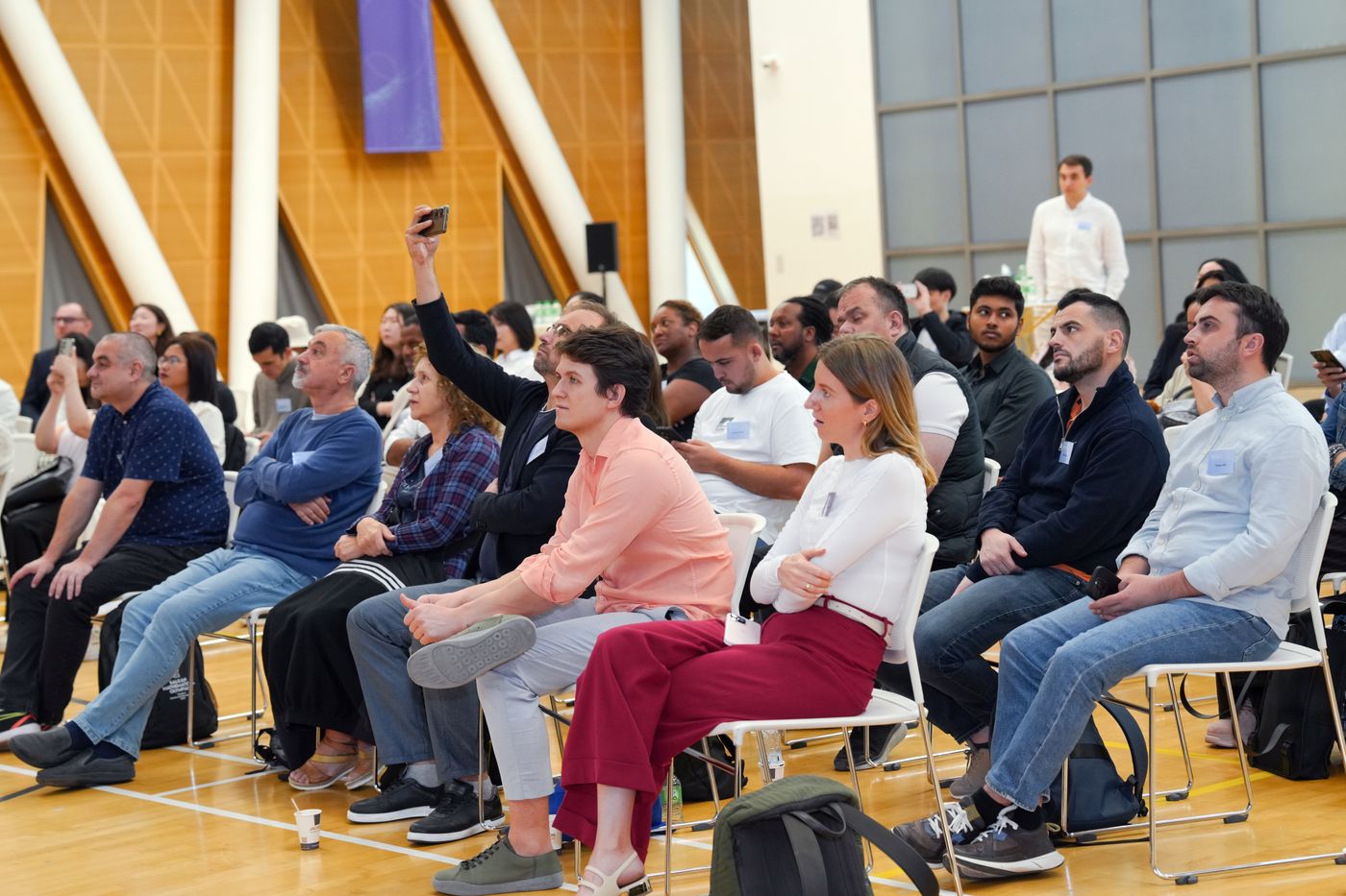 Business owners and managers engaged at a live AI seminar
